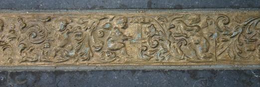 Memorial stone: border decoration in bronze, copied from a bell in the Dom carillon