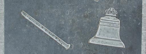 Memorial stone: Illustrations of recorder and bell